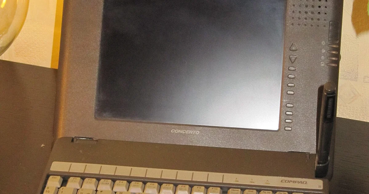 Compaq Concerto 4/25 laptop / Tablet PC Shown in laptop configuration: with attached keyboard, pen in holder and open pen compartment above the screen.
